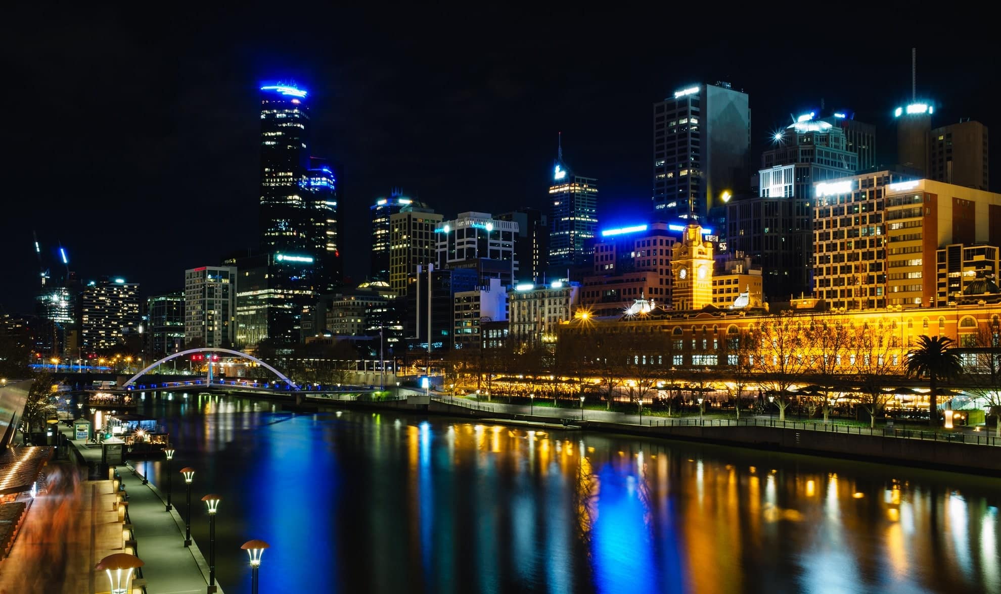 image for the australian resident for tax purposes article: city lights reflect along the yarra river in melbourne, australia