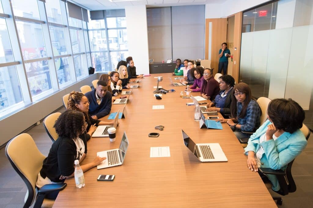 a group of business owners having a discussion in the conference room