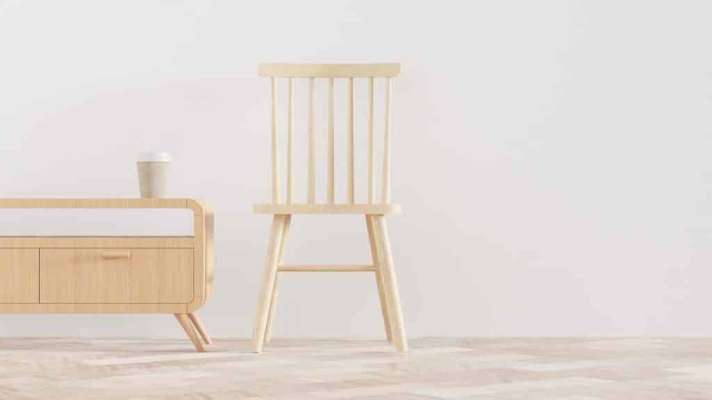 A minimalist wooden chair next to a wooden centre table