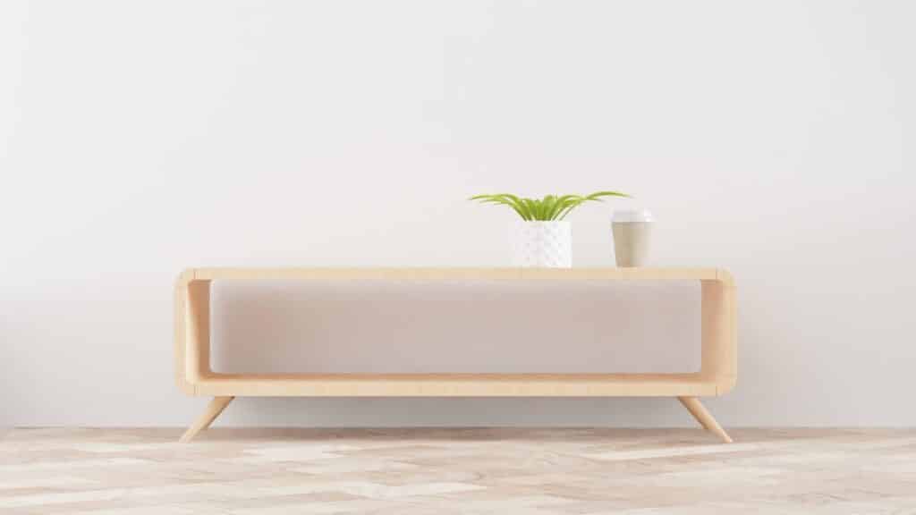 A minimalist table set against a white wall