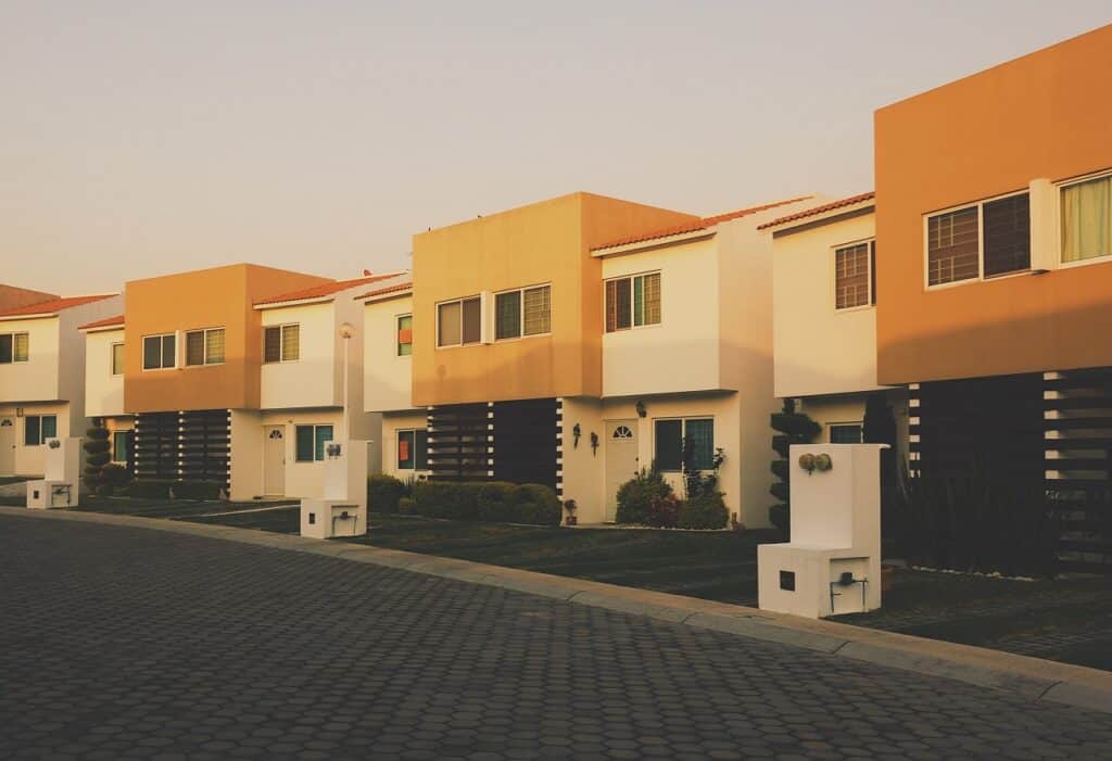 a residential building with white, black and orange paint