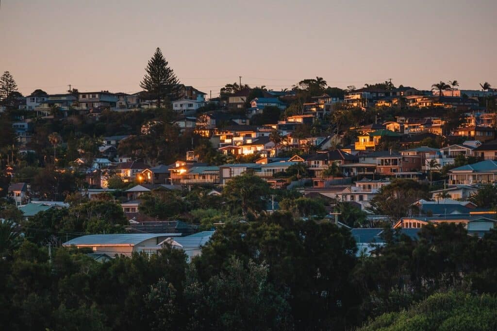 lights start to appear at dusk in a suburb in sydney, australia