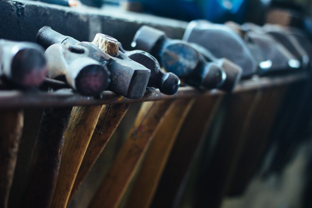 a closeup photo of a collection of masonry hammers