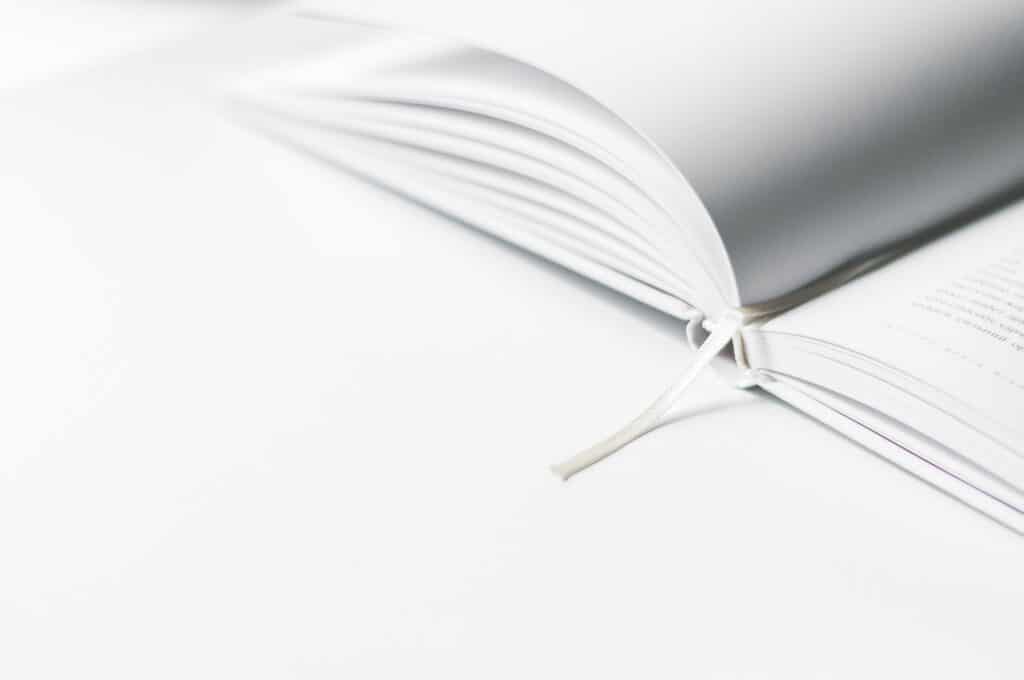 a white book that is opened halfway through the pages