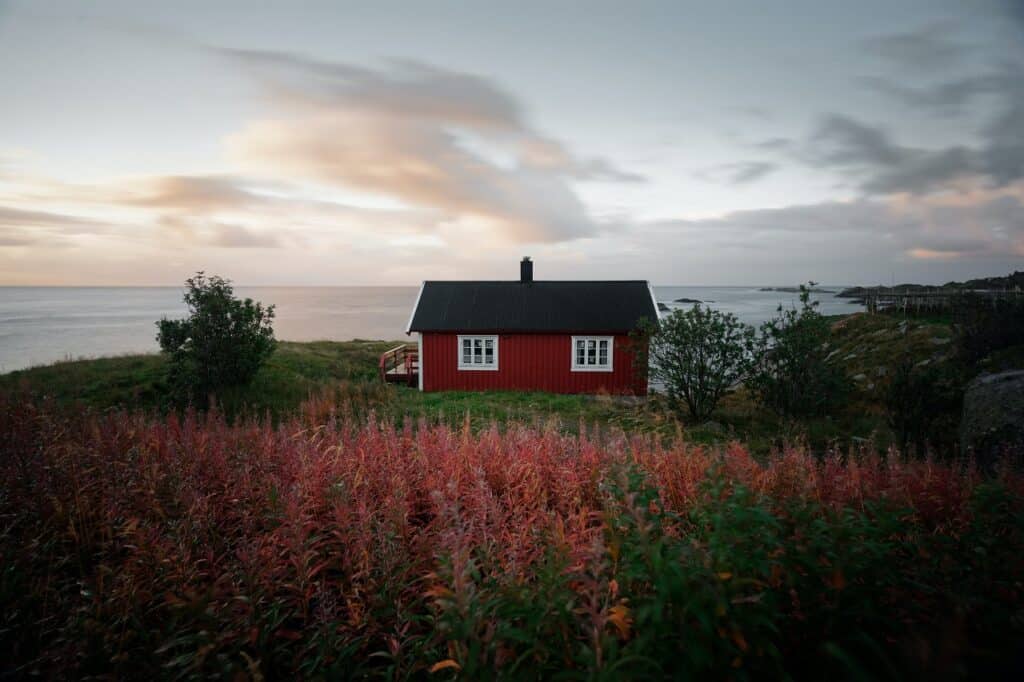 a nice little red house overlooking the ocean