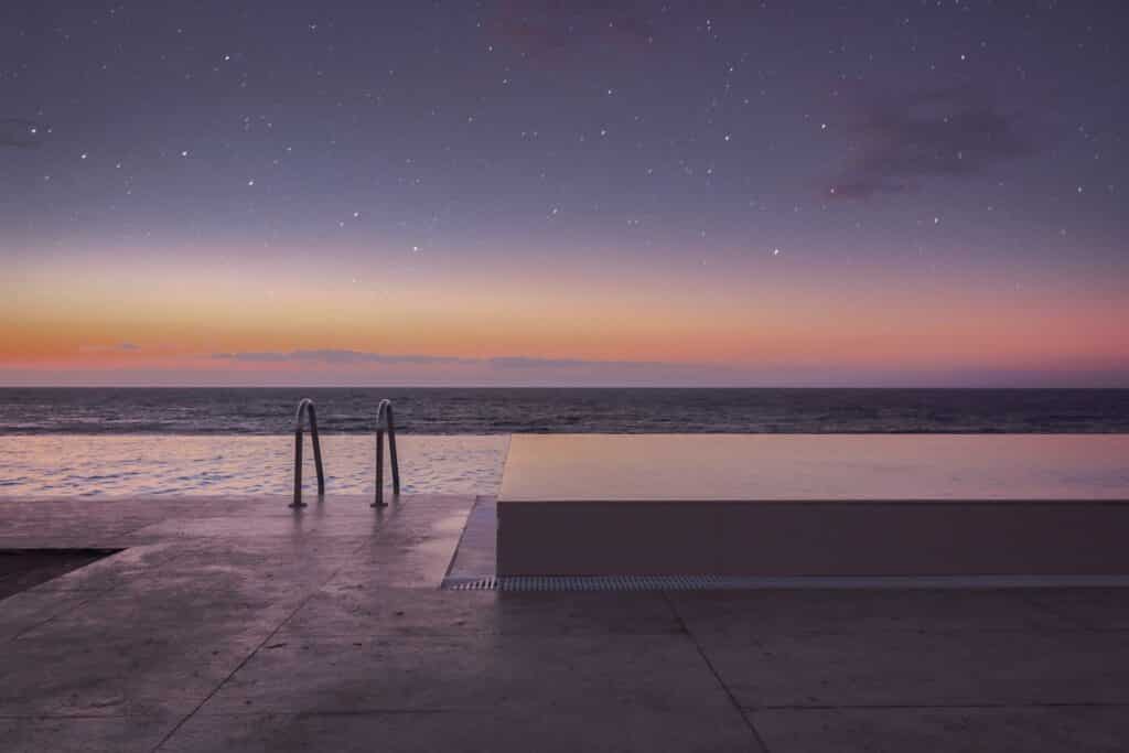 at infinity pool that overlooks the sea