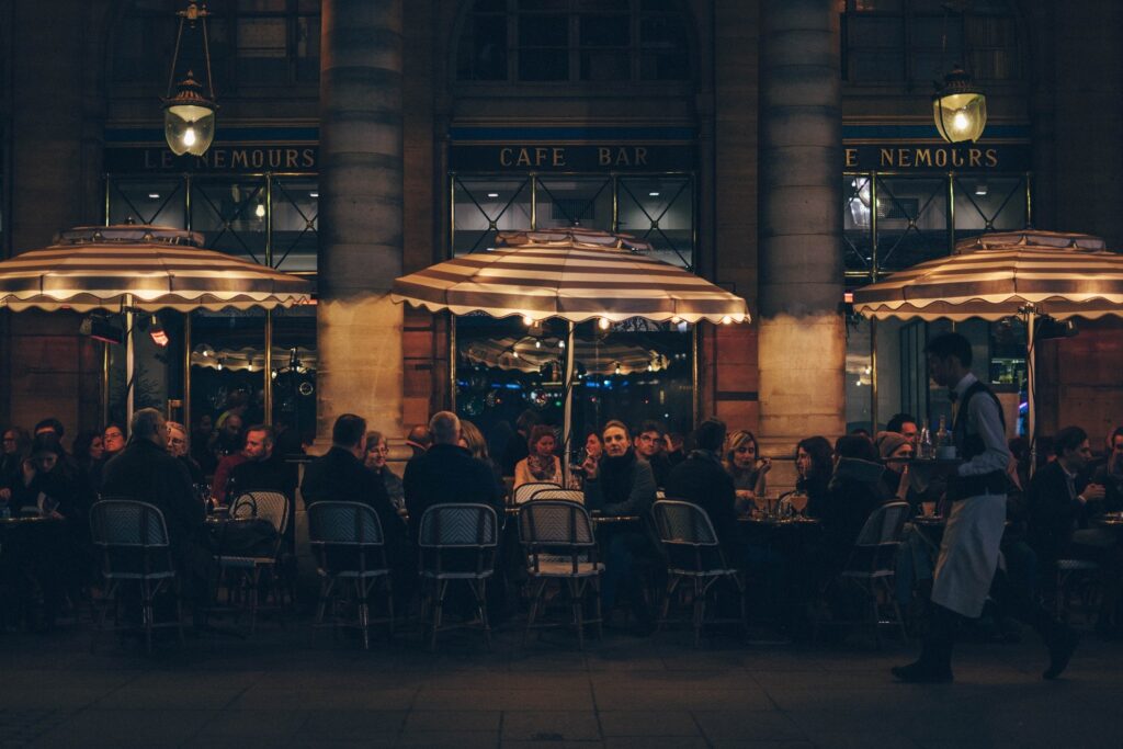 people enjoying street dining