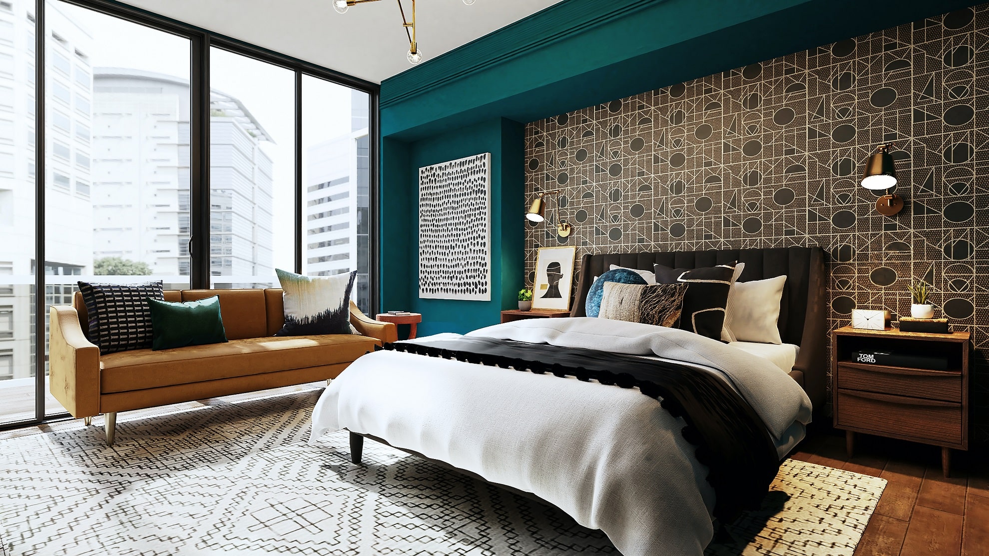 An apartment bedroom with textured walls and picture frames, patterned rugs, and terra cotta furniture.