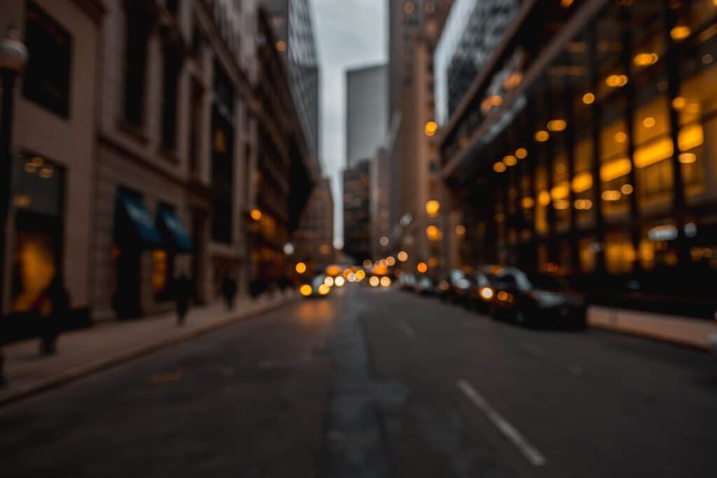 a blurred image of a street in an early evening