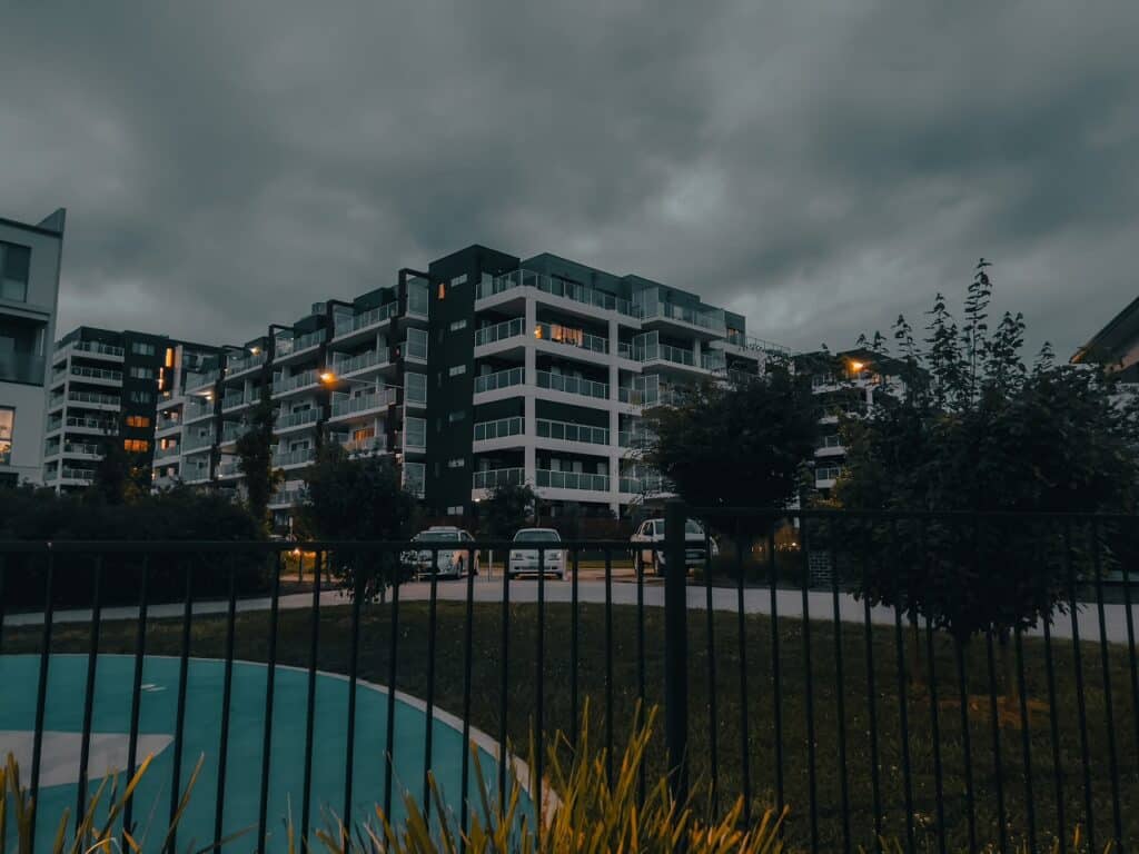 lights in an apartment building in tuggeranong, act, australia in an early evening