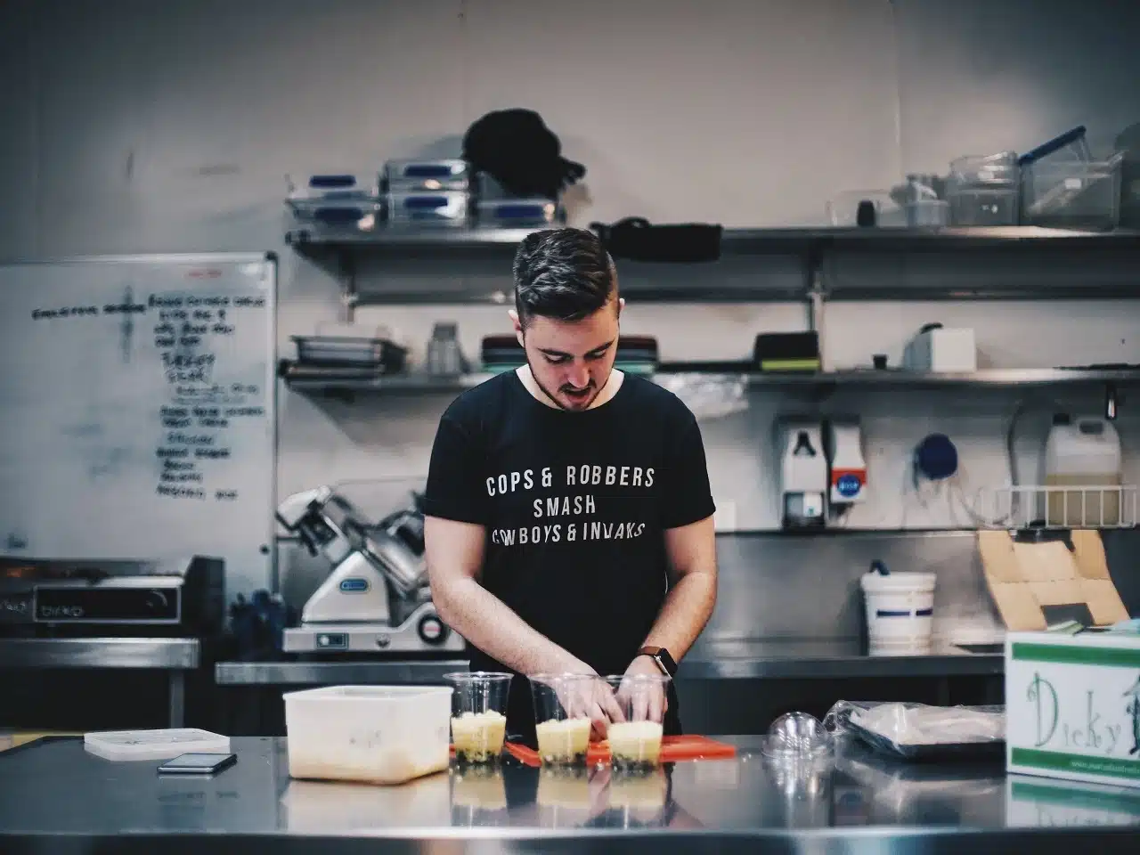 a man seen preparing a dessert by the kitchen counter