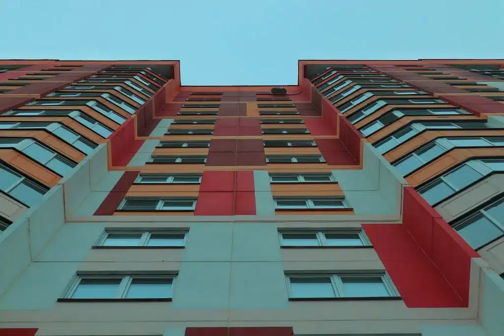 a worm's eye view of a red and white building