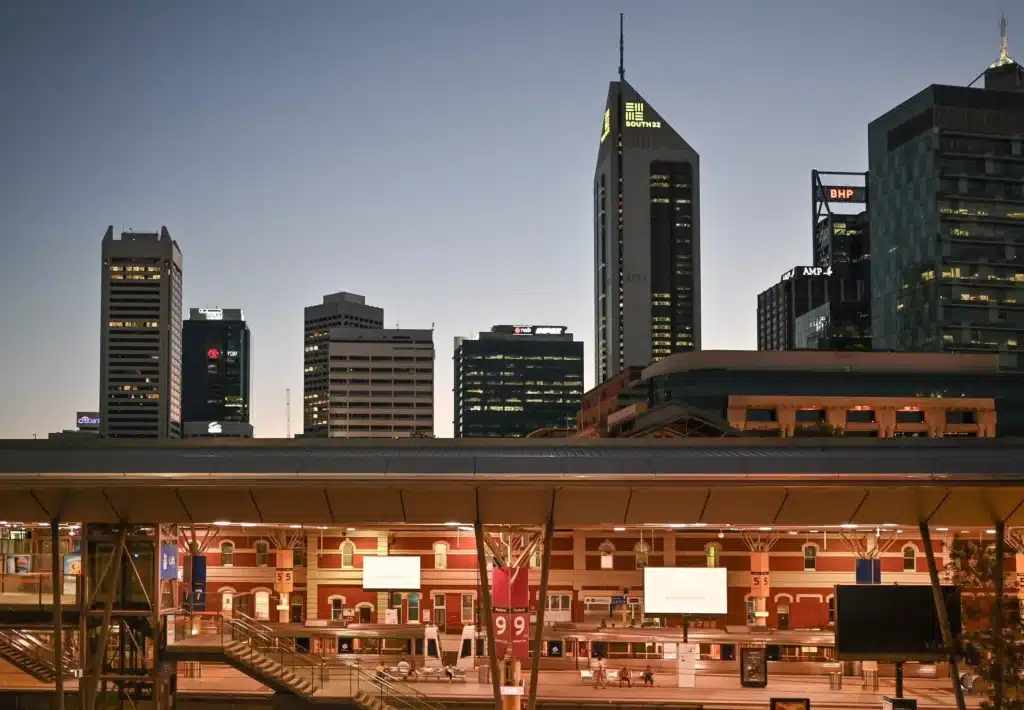 a view of the train station in perth, western australia at dusk