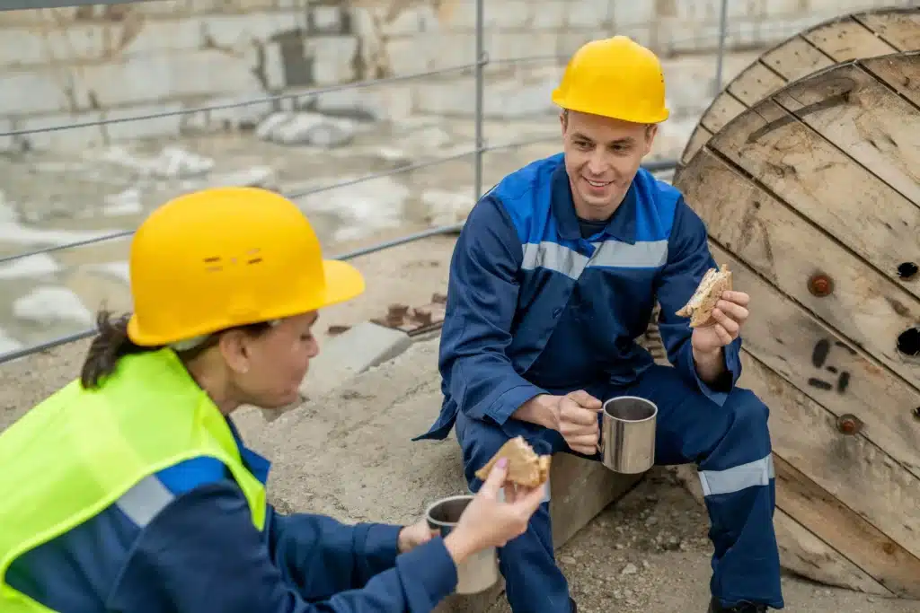 Construction workers chatting over coffee representing the concept of tax deductions for construction workers.