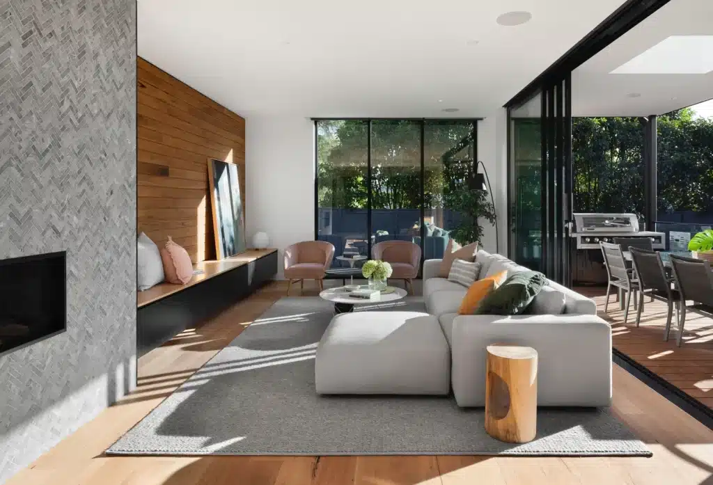 A modern living room with floor-to-ceiling windows representing the concept of tax deductions for real estate agents.
