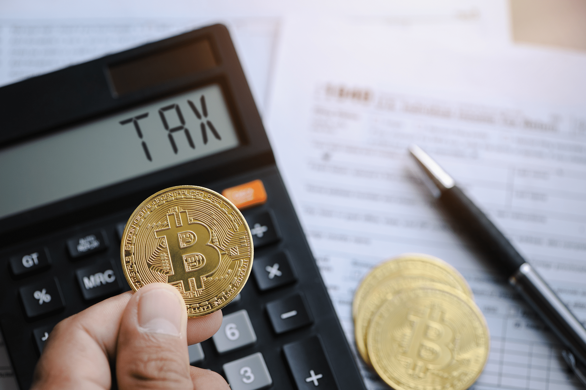 Bitcoin taxation or crypto concept with tax form 1040 in Individual Income Tax Return.