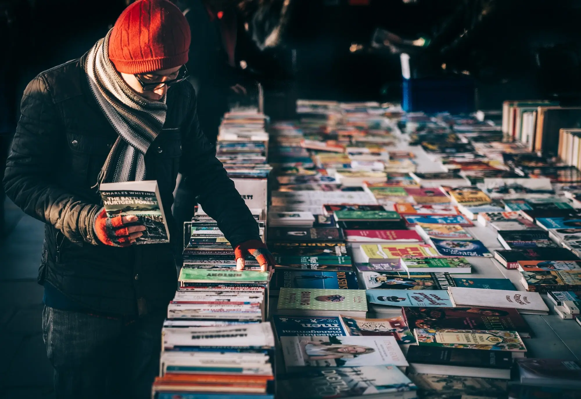 A man shopping for trade books, representing the concept of GST input tax credits.