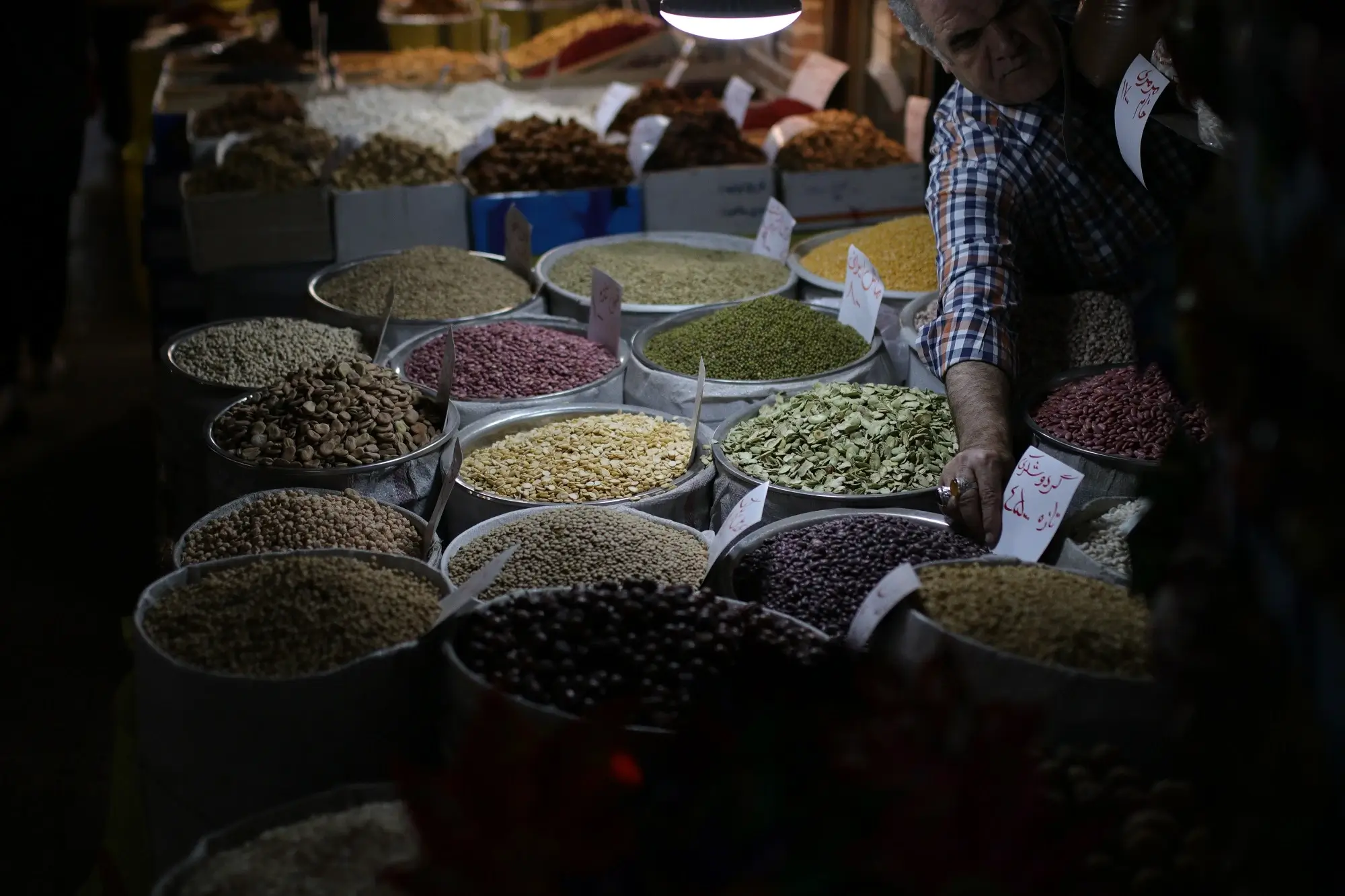 A marekt stall selling different kinds of seeds, representing the concept of GST input tax credits.