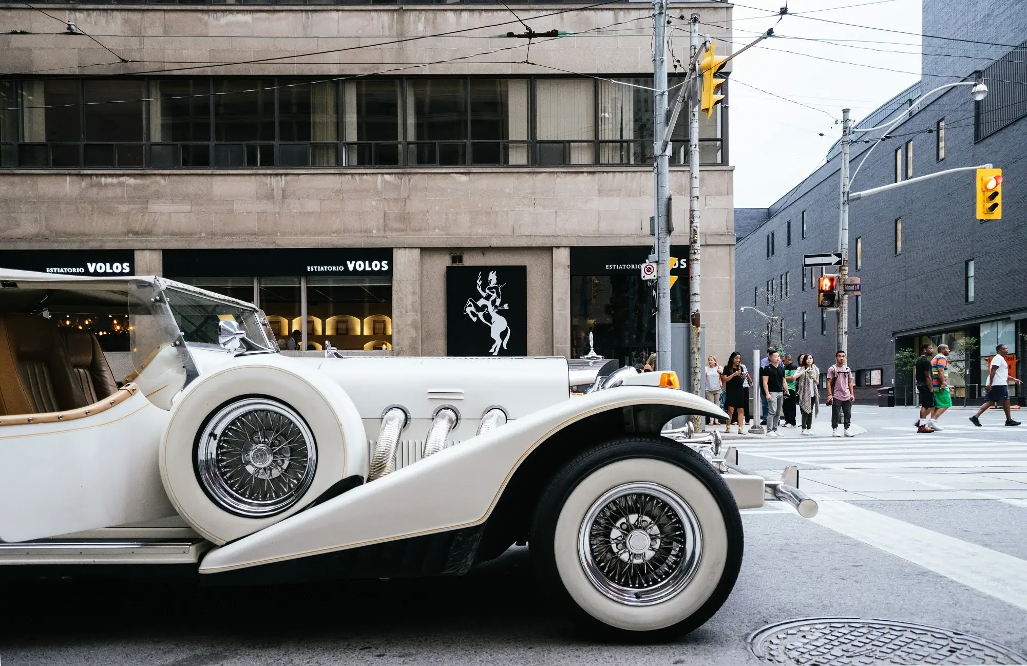 A white vintage luxury car.