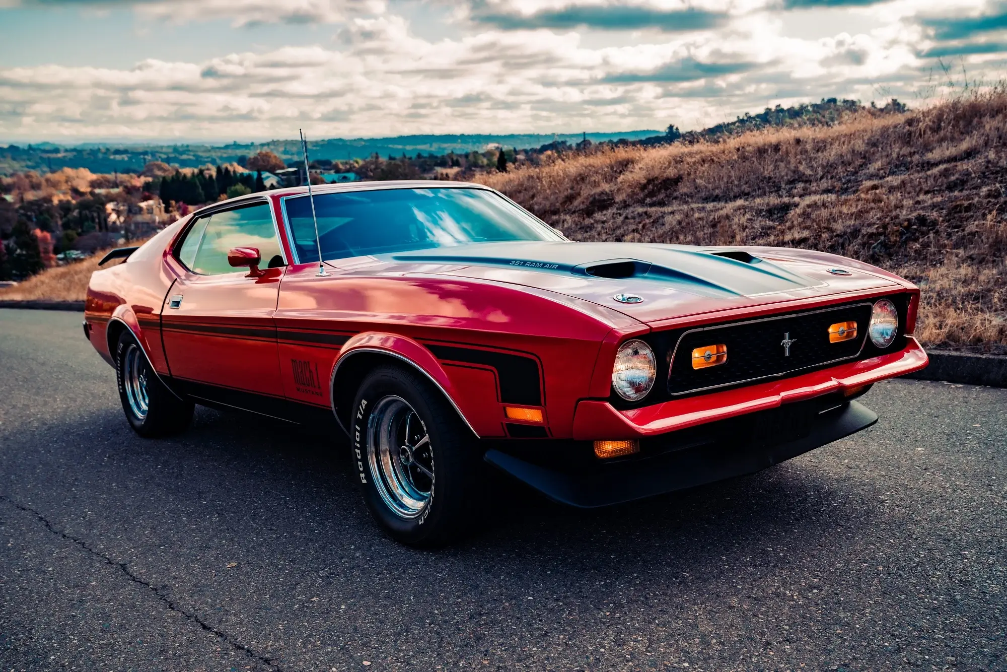 A red 1972 Ford Mustang Mach 1, representing the concept of car FBT.