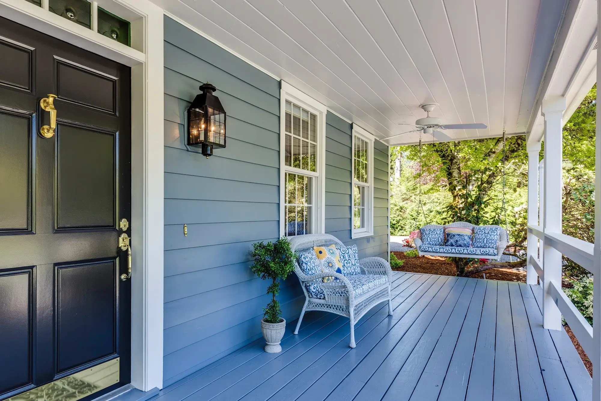 A porch with cushioned chairs, representing the concept of SMSF property.