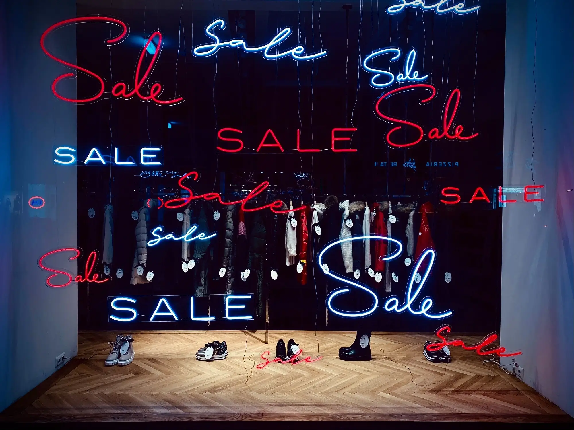 A storefront advertising a sale, representing the concept of non commercial losses.