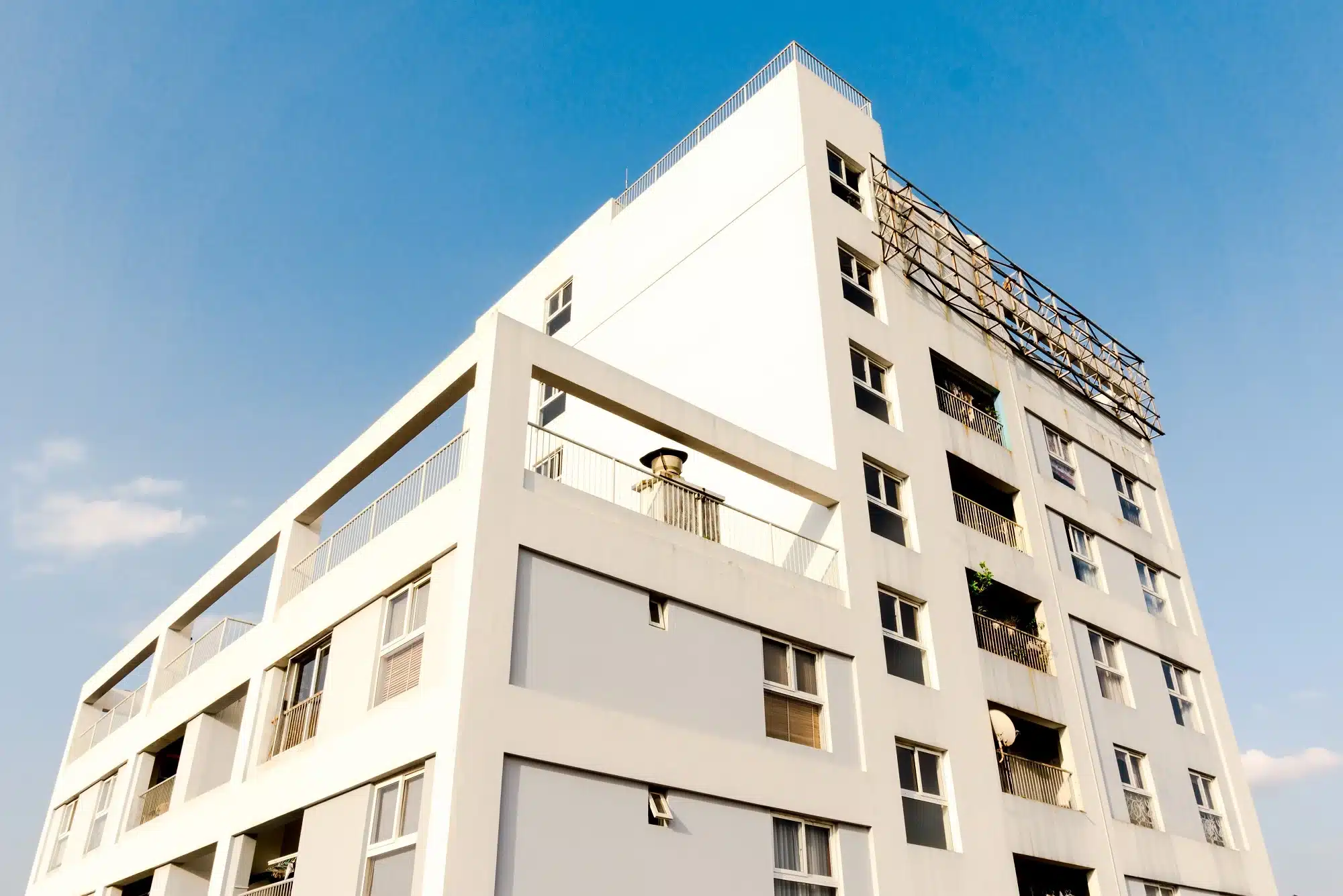 White concrete building, representing the concept of property development.
