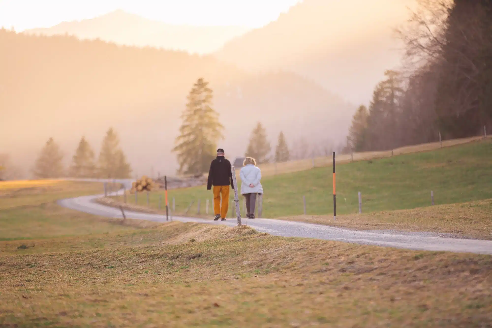 A retired couple talking a walk on a mountain trail, representing the concept of super conditions of release.