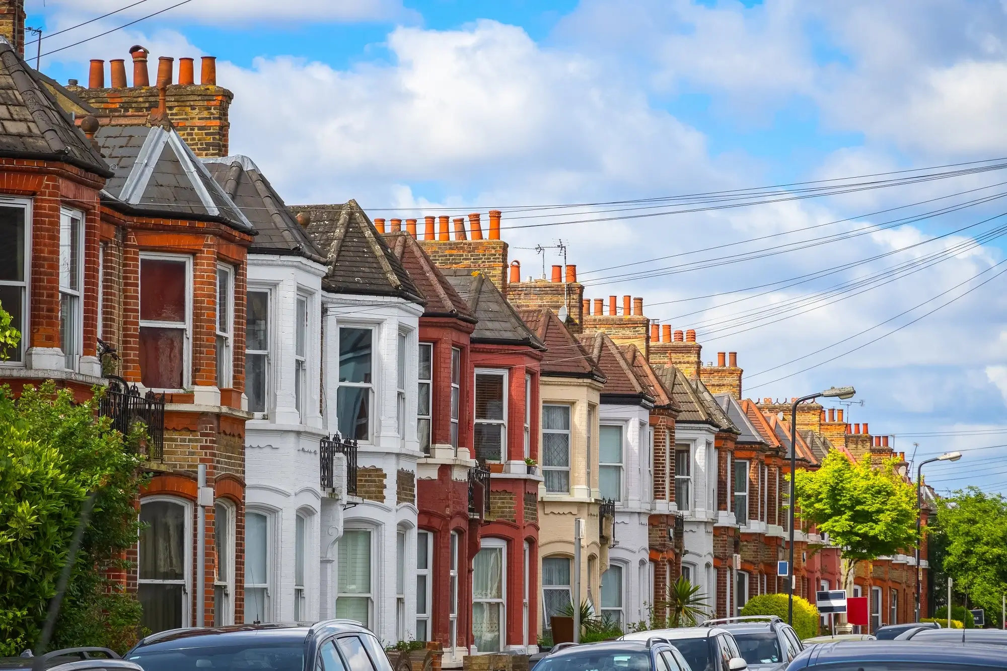 A row of British terraced houses, representing the concept of housing fringe benefit.