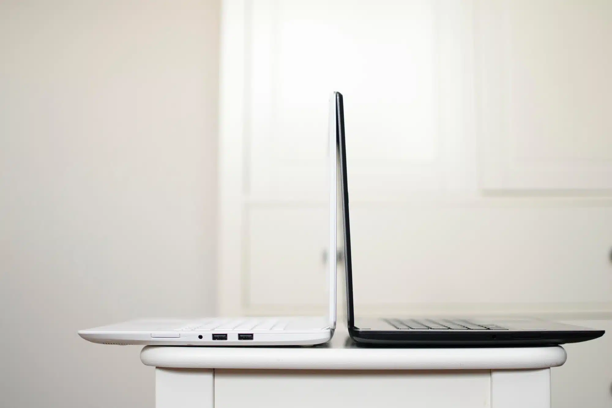 double-tax-agreement-tax-accountants-4 A black and white laptops placed back to back.