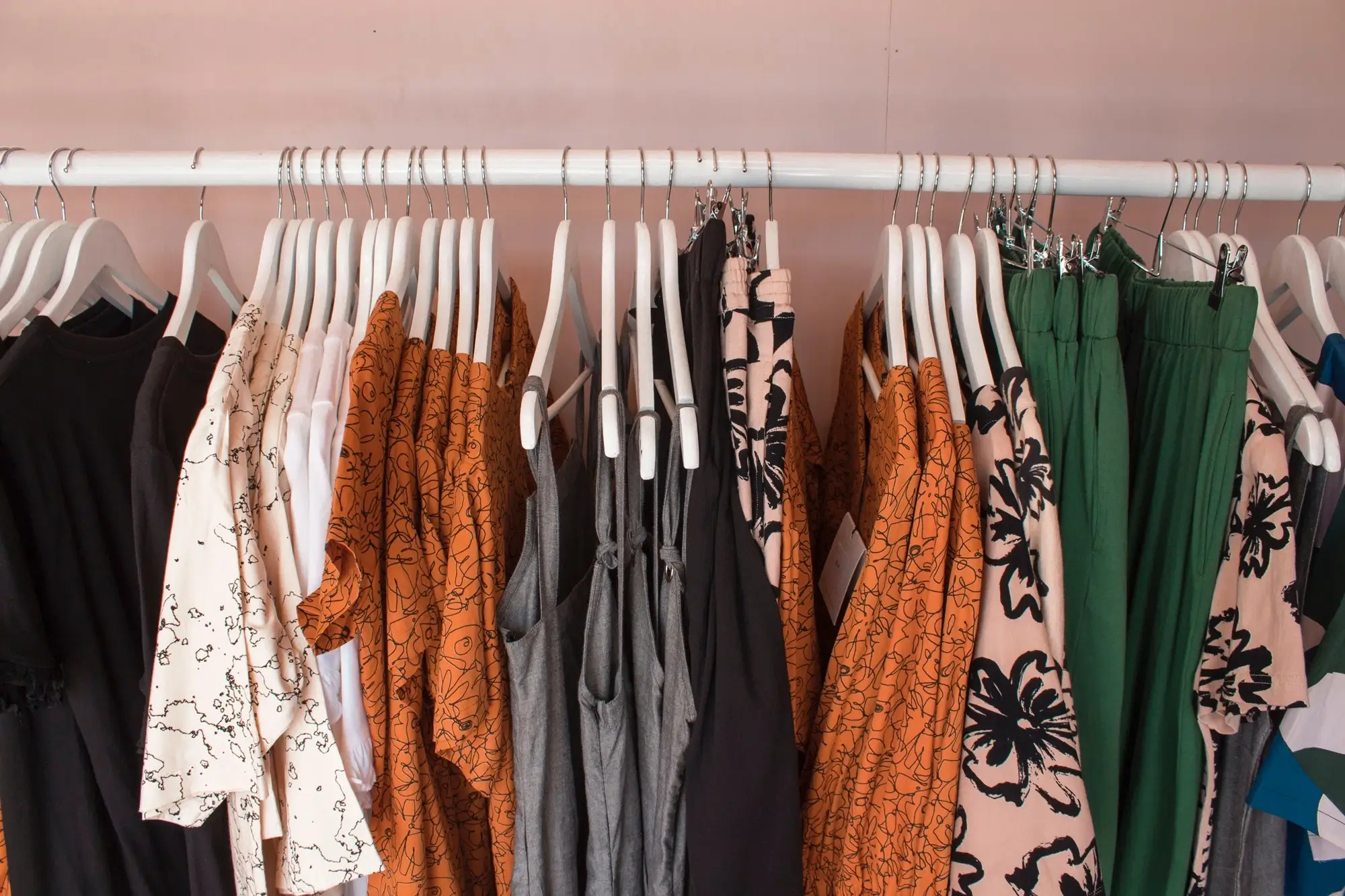 A line of clothes inside a dress shop, representing the concept of permanent establishment.