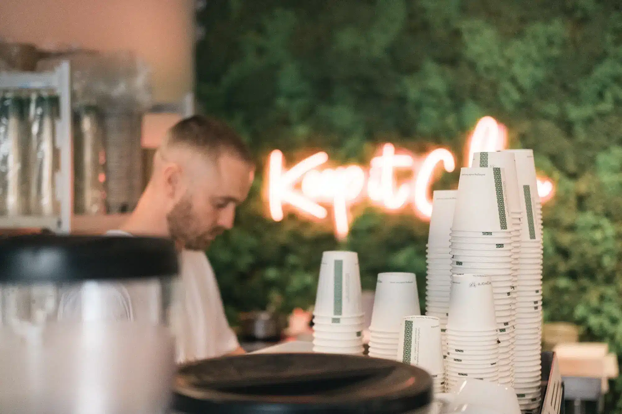 A display of paper cups inside a coffee shop.