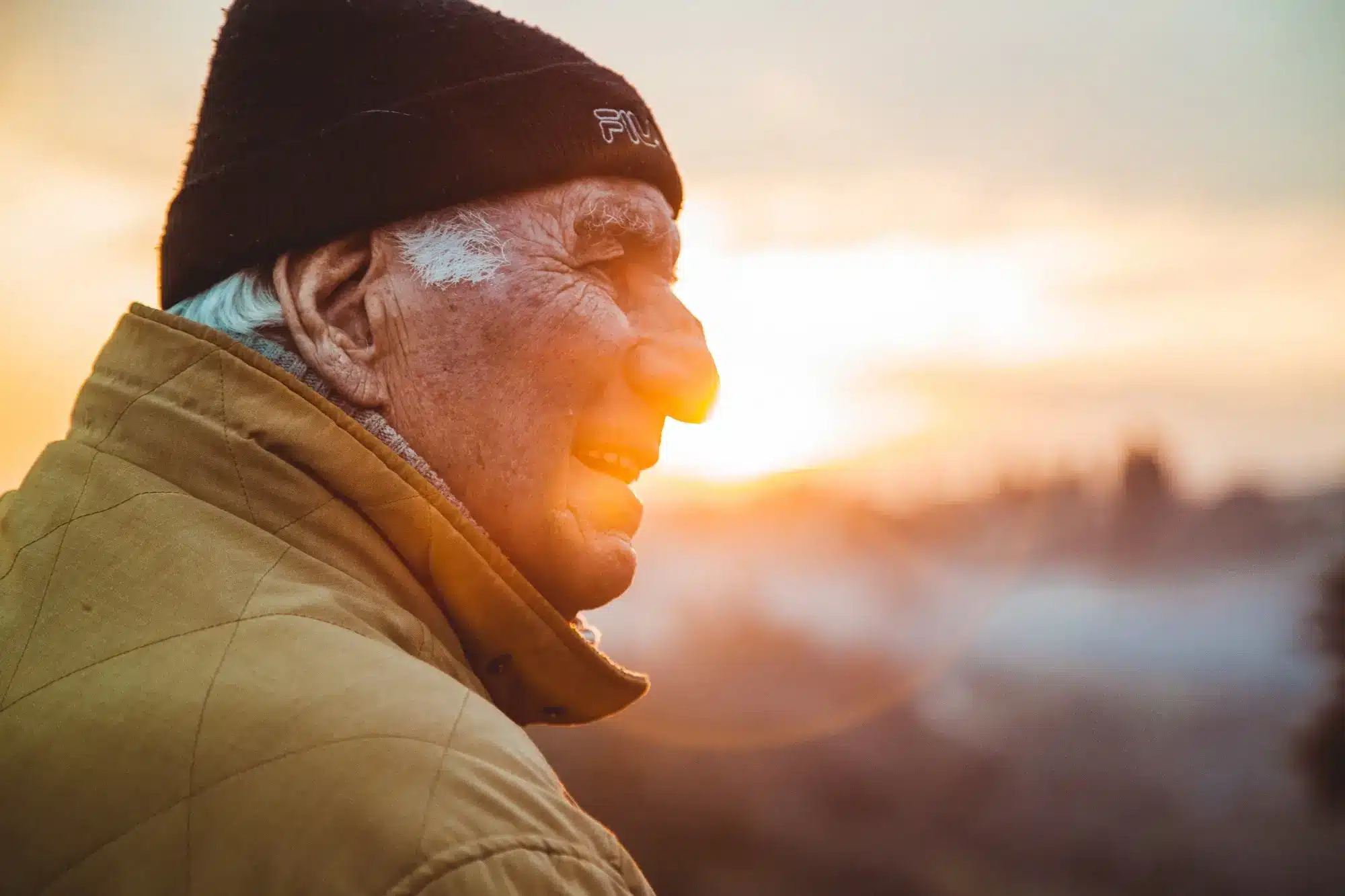 An retired man looking at the sunrise, representing the concept of super contributions.