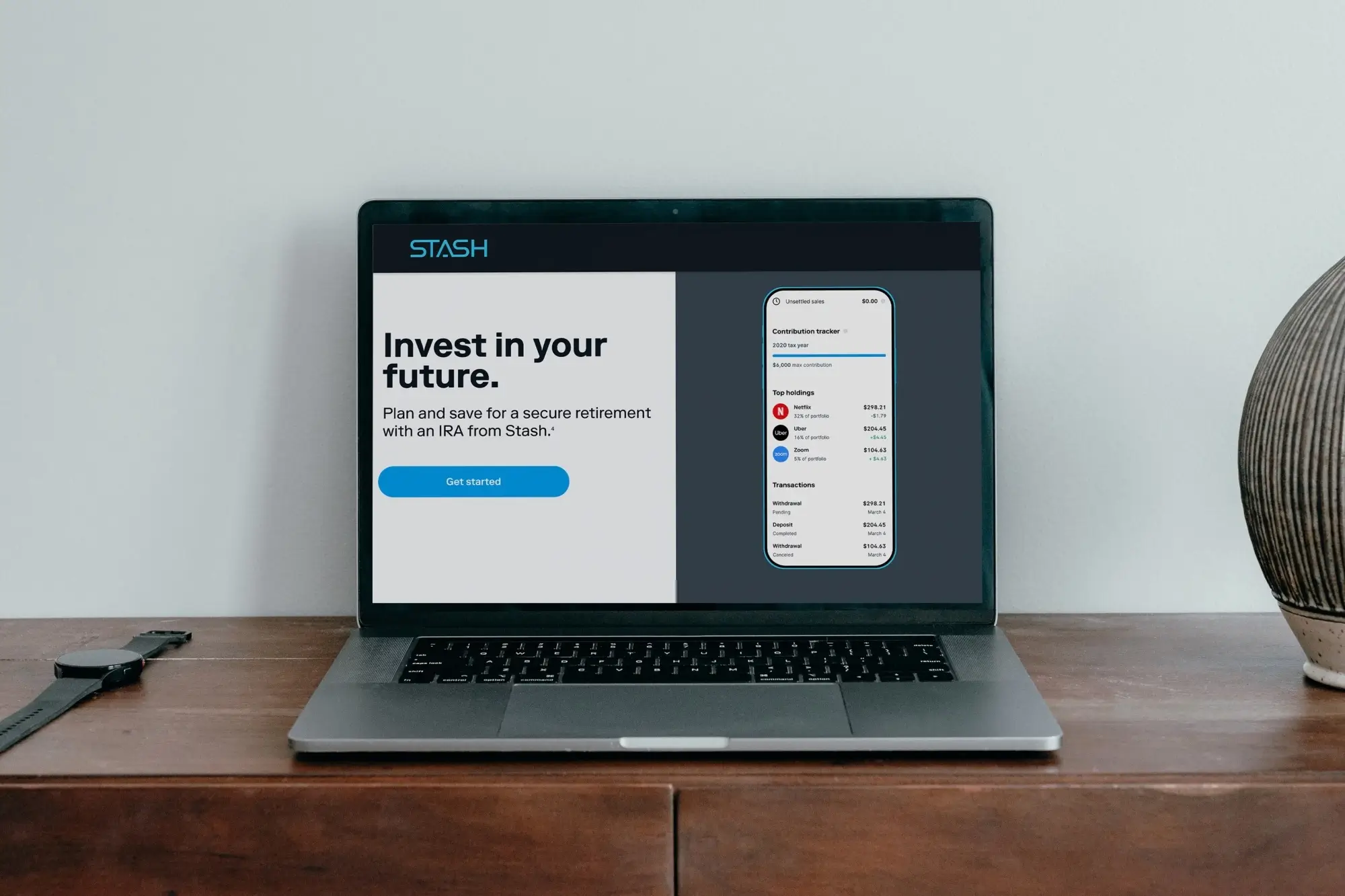 A laptop showing an investment website.