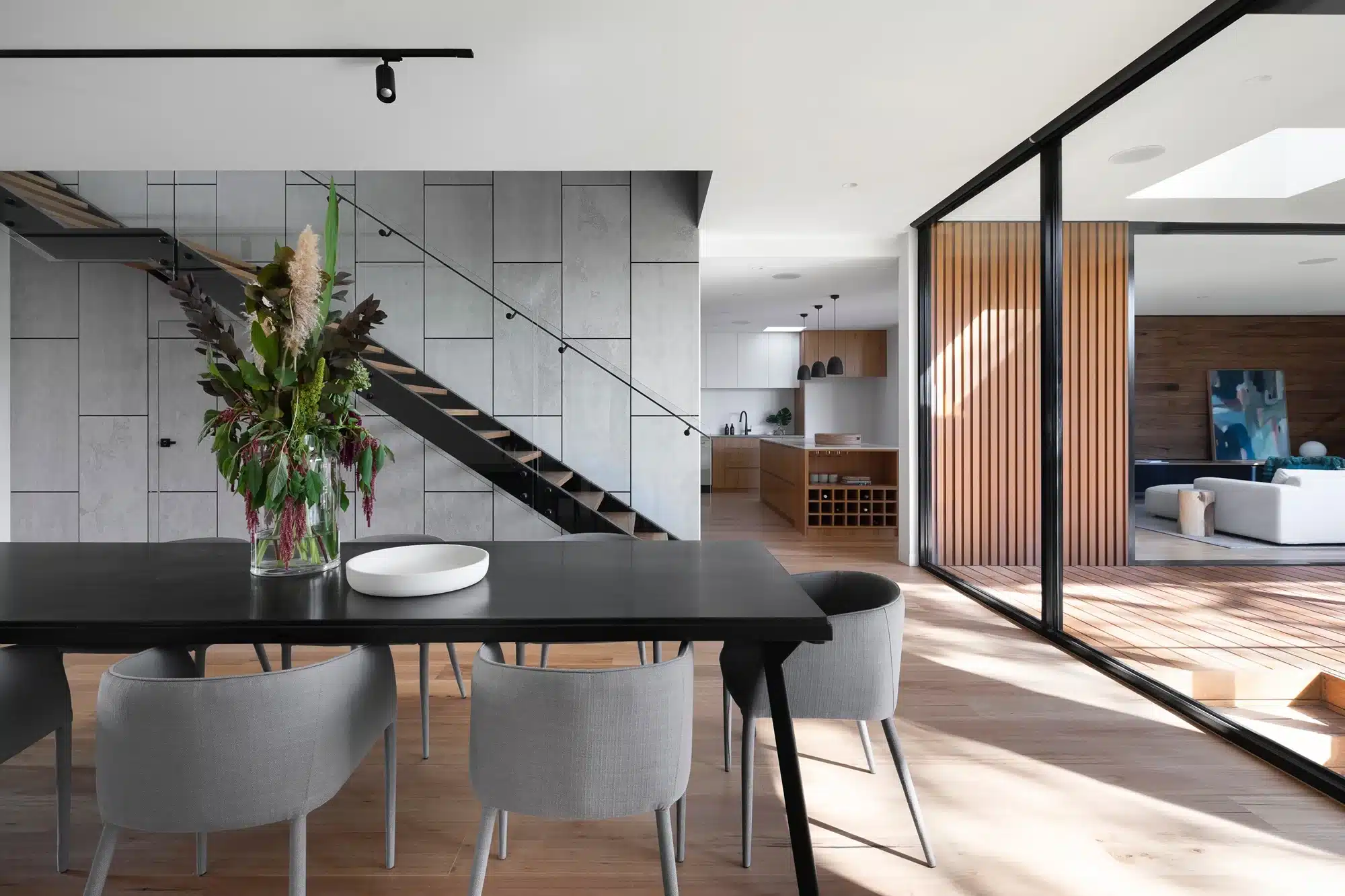 A dining area separated by a glass wall, representing the concept of family trust.