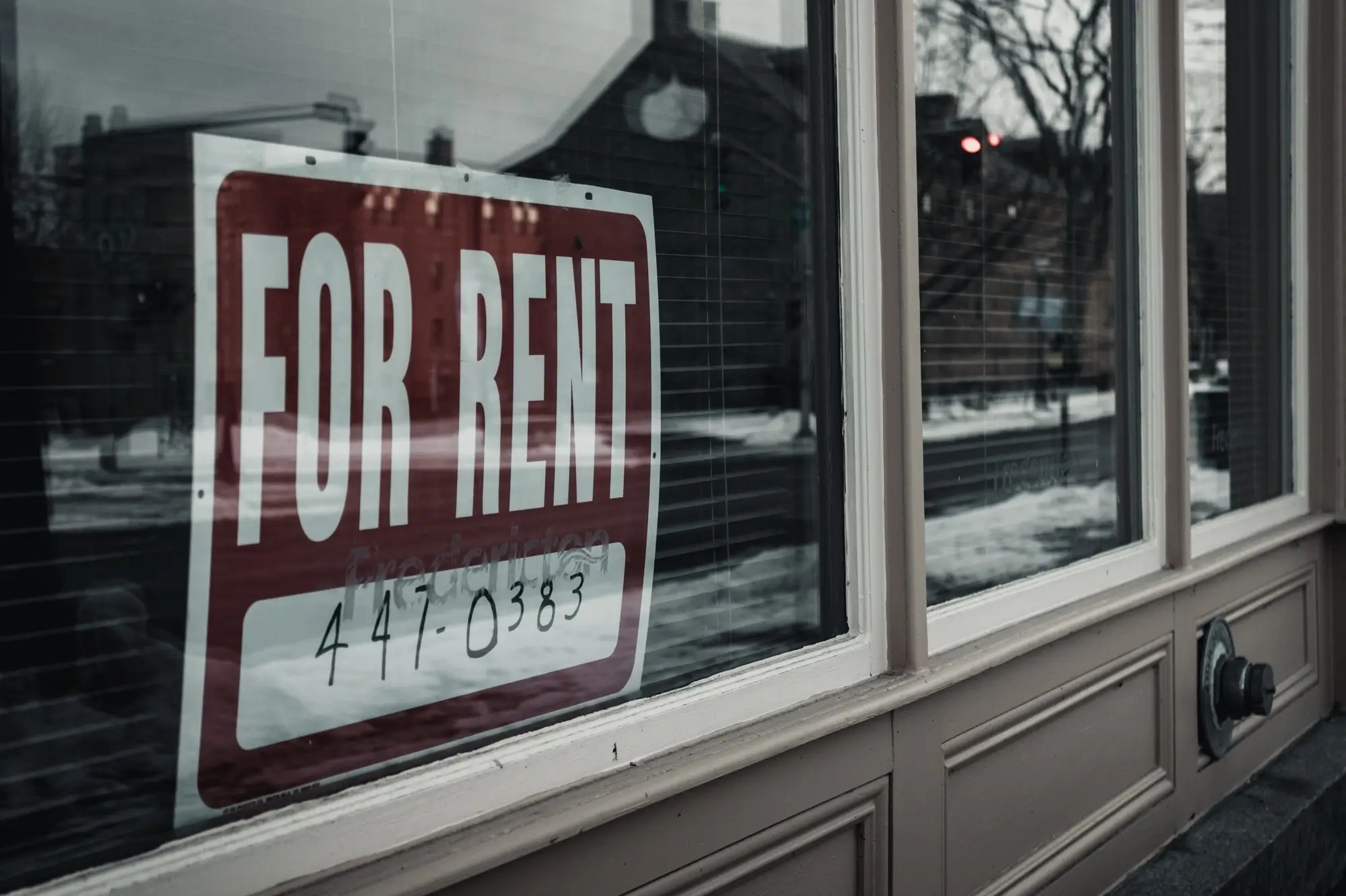 A for rent sign by a window shop, representing the concept of hire purchase agreement.