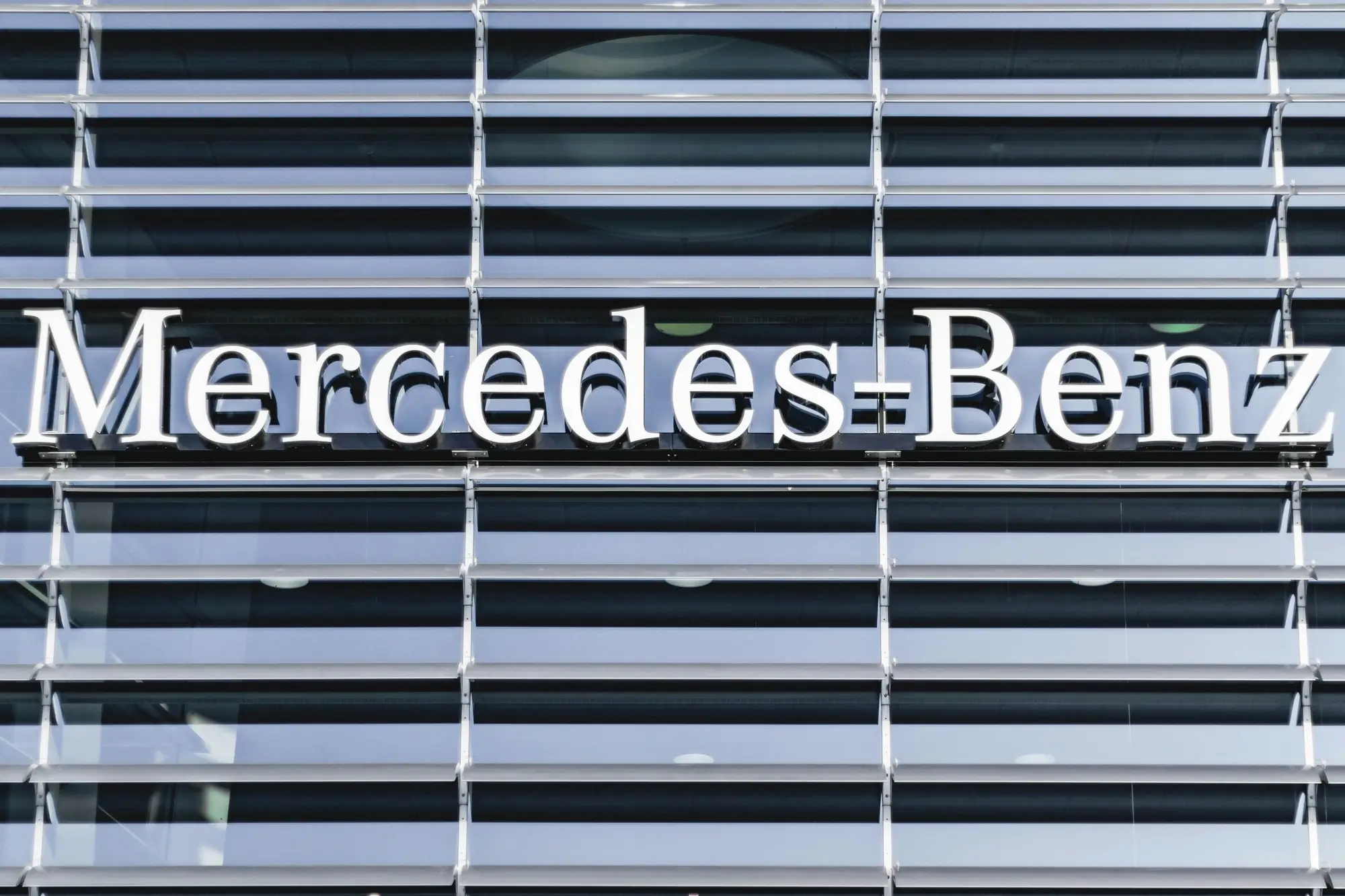 A closeup of a Mercedes-Benz logo at headquarters, representing the concept of pty ltd company.