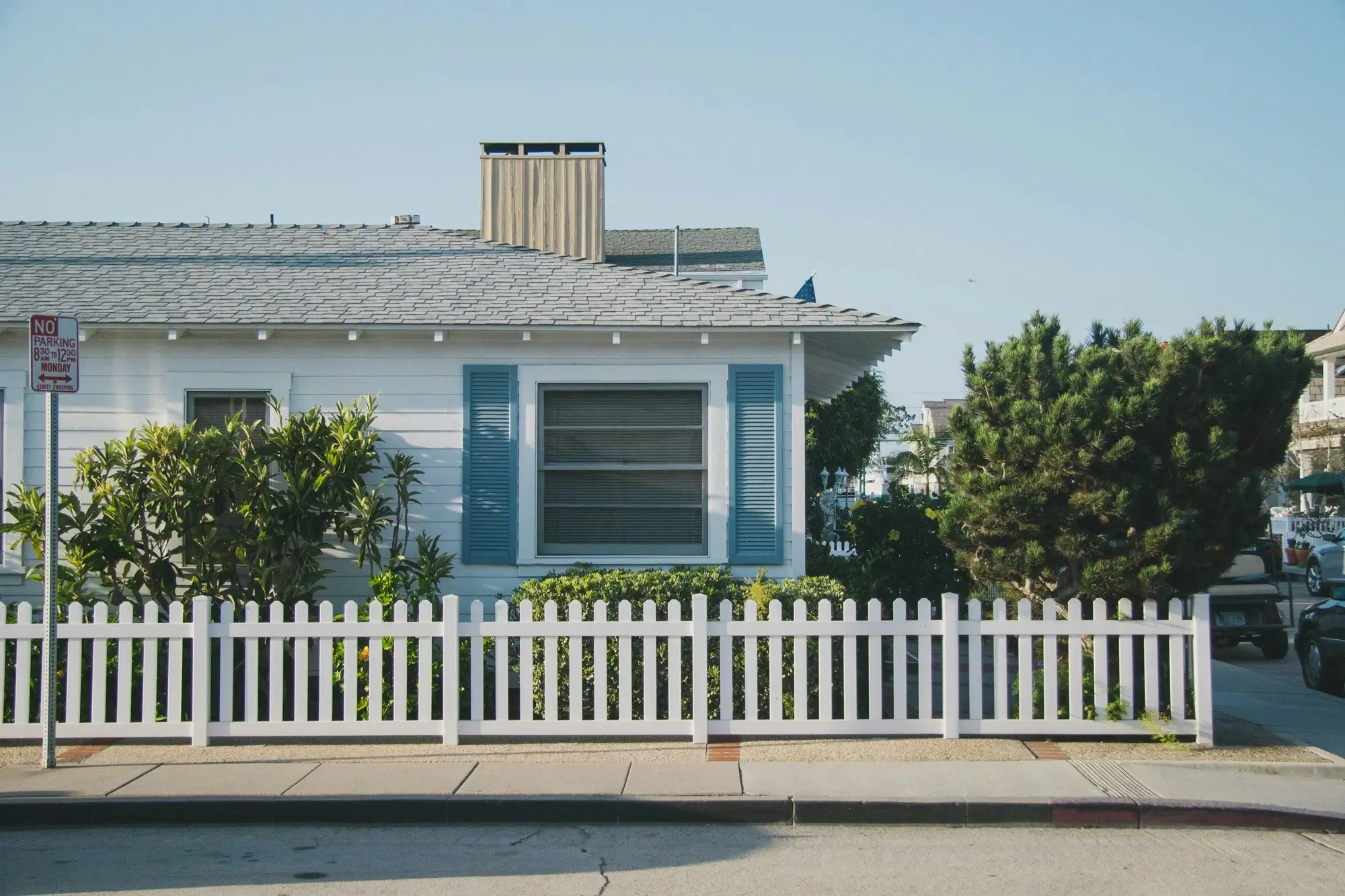 A house with a white picket fence, representing the concept of testamentary trust.