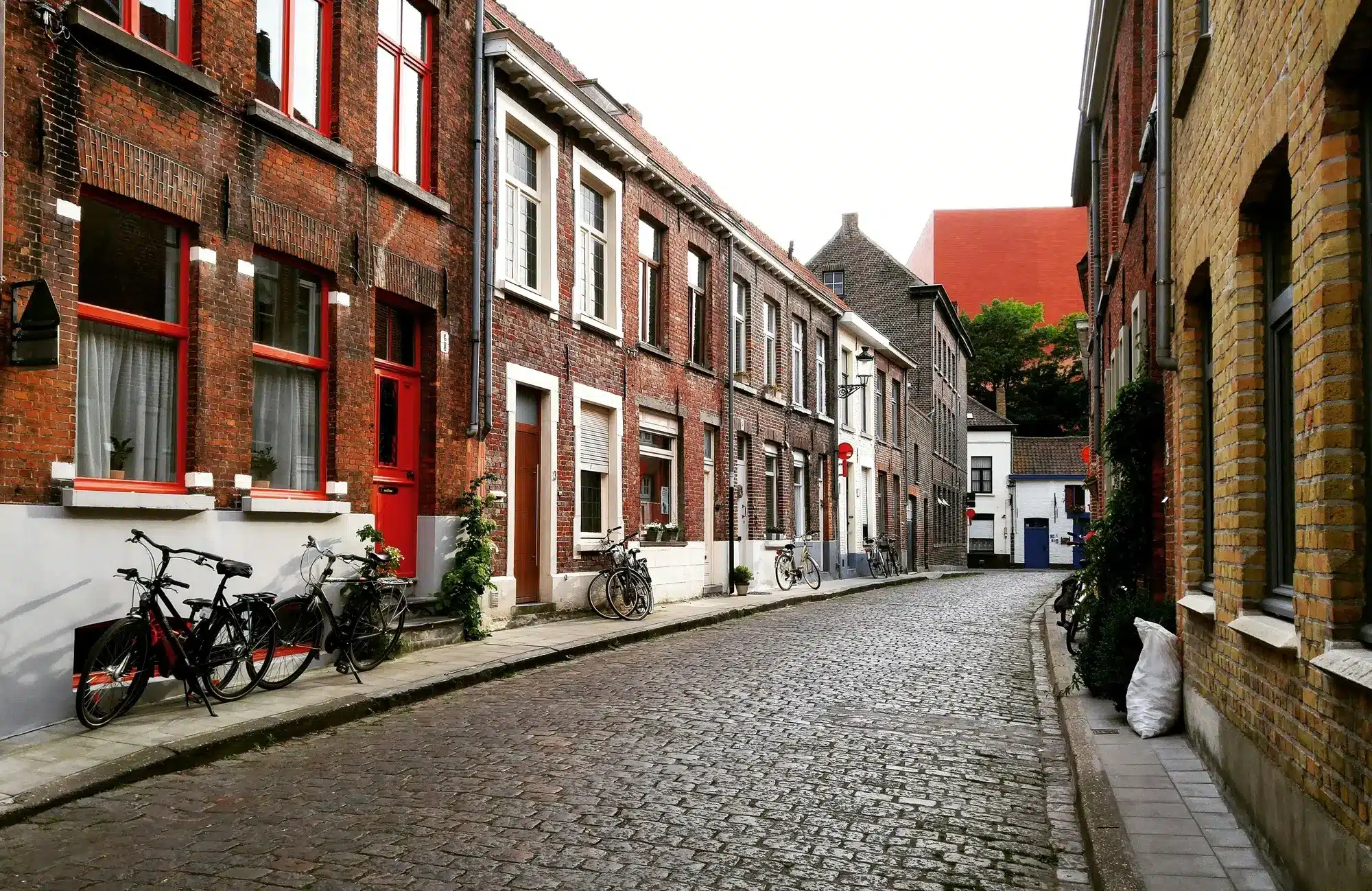 A cobblestone street with brick buildings, representing the concept of testamentary trust.